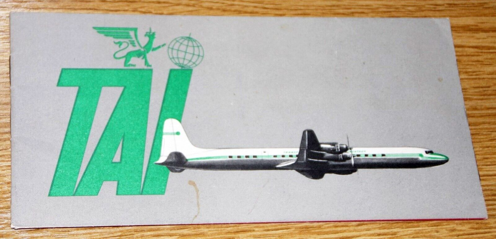1950s T.A.I AIRLINE FRANCE BROCHURE FOR DOUGLAS DC-7C AIRCRAFT ENTRY IN SERVICE