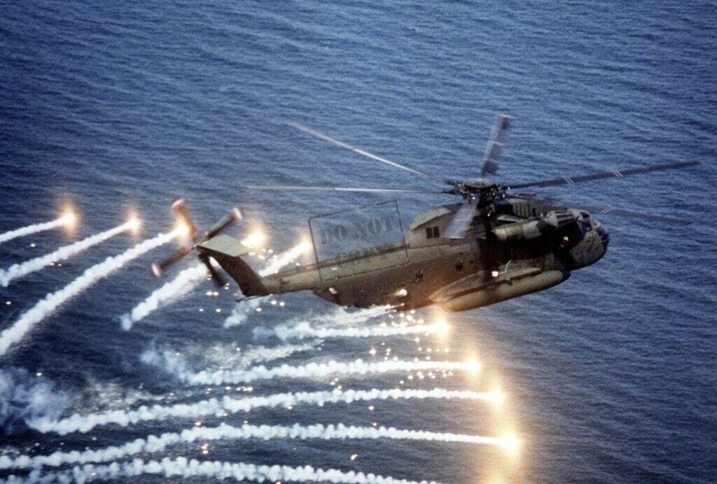 US NAVY USN CH-53D Sea Stallion helicopter spewing flares 12X18 Photograph