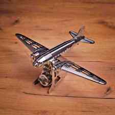 A metal model of a DC-3 named 