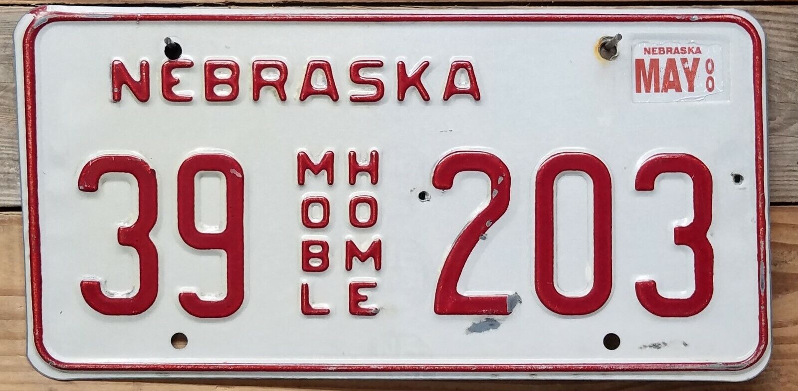 Nebraska expired 2000 Mobile Home Red On White License Plate ~ 39 203 - Embossed