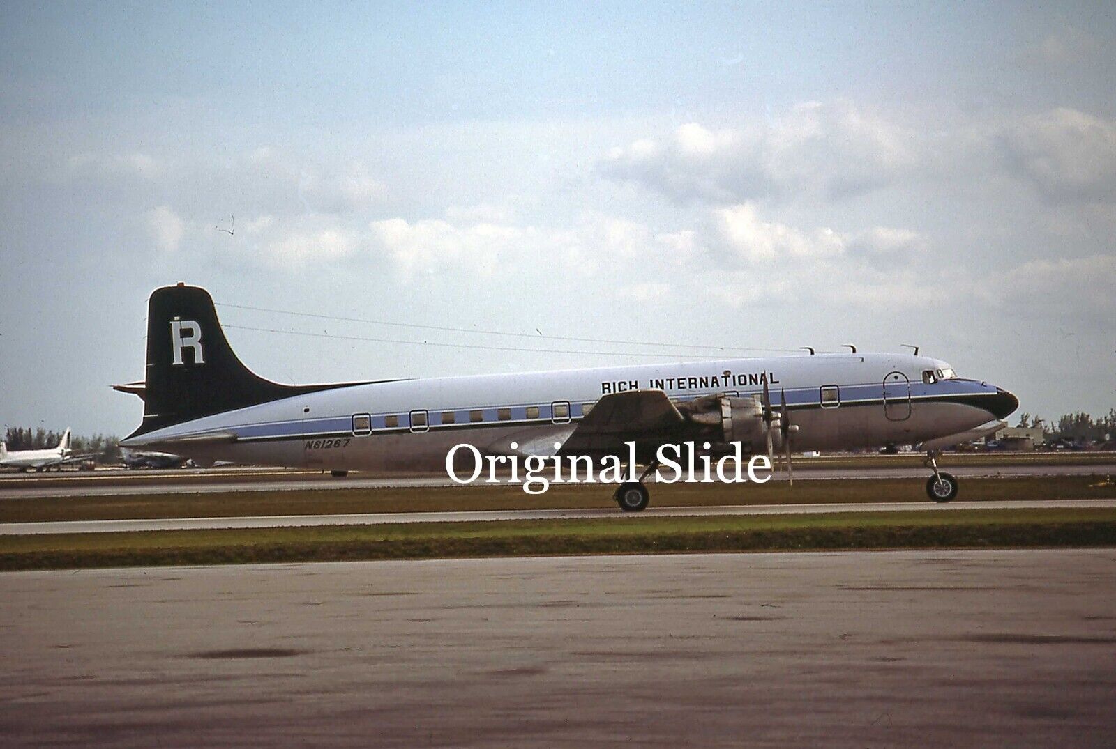 Aircraft Slide - Rich International DC-6A N61267 @ MIAMI 1978    (B117)