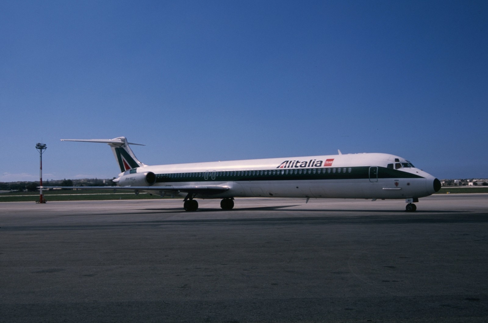 Original 35mm colour slide of Alitalia McDonnell Douglas MD-82 I-DAWJ at MLA