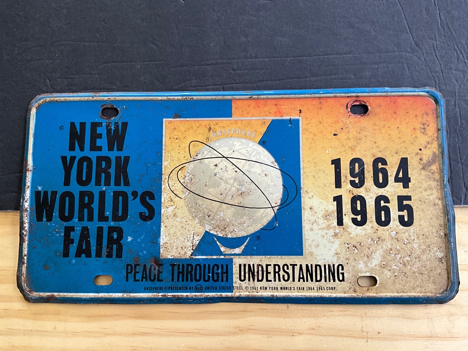 1964 1965 New York World’s Fair License Plate Booster STEEL Peace Understanding