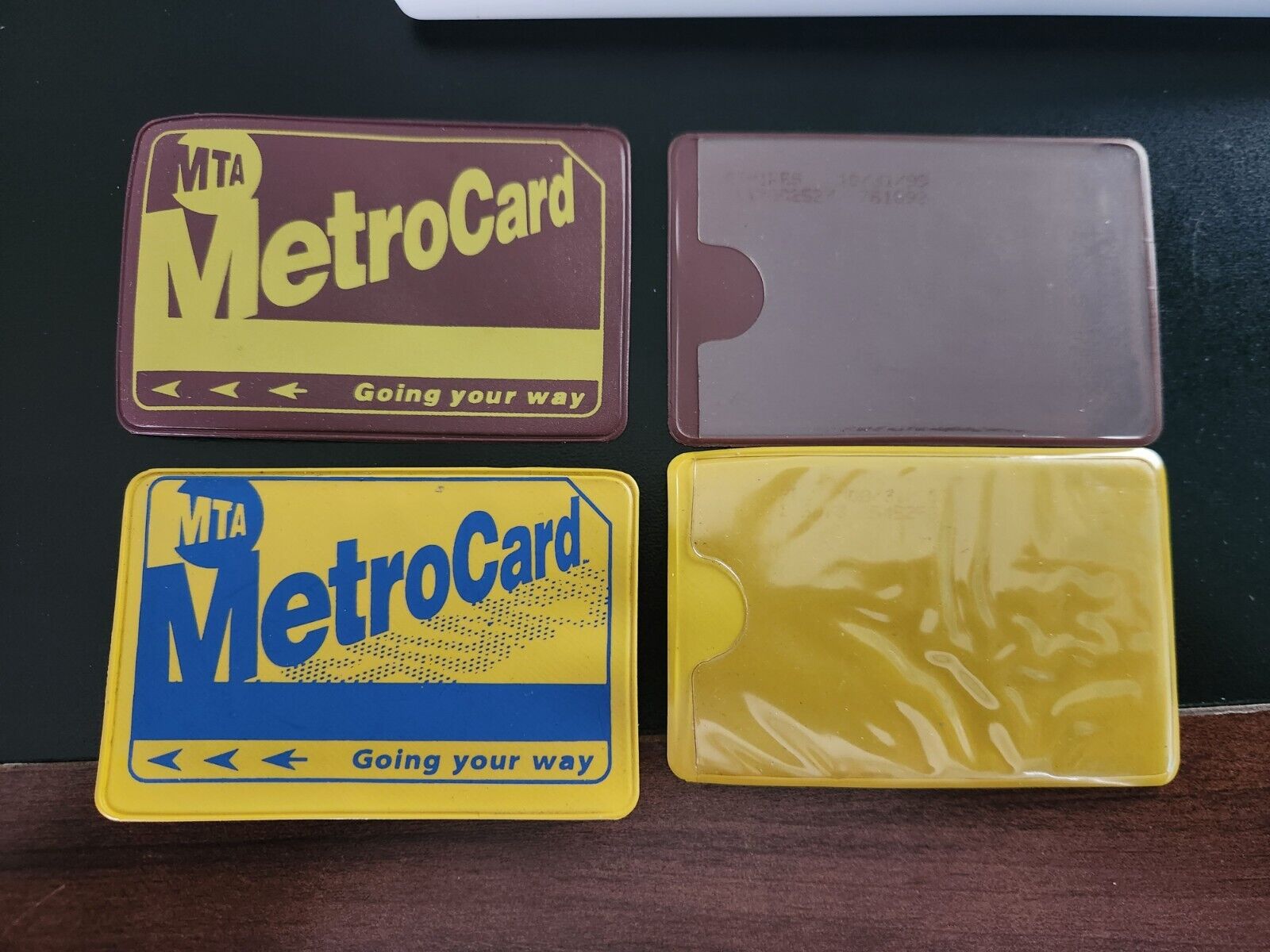2 NYC Metrocard  Yellow and Brown Holders . Soft plastic . Never used