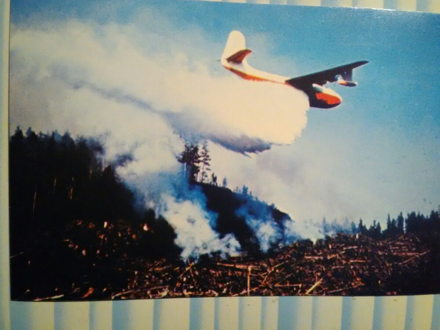 VINTAGE POST CARD MARS WATER BOMBER IN ACTION OVER VANCOUVER ISLAND B.C.CANADA.