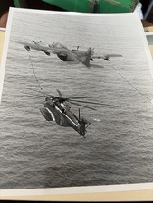 Photograph Aircraft KC-130 refueling a Navy Ch-53 Sea Stallion helicopter picture
